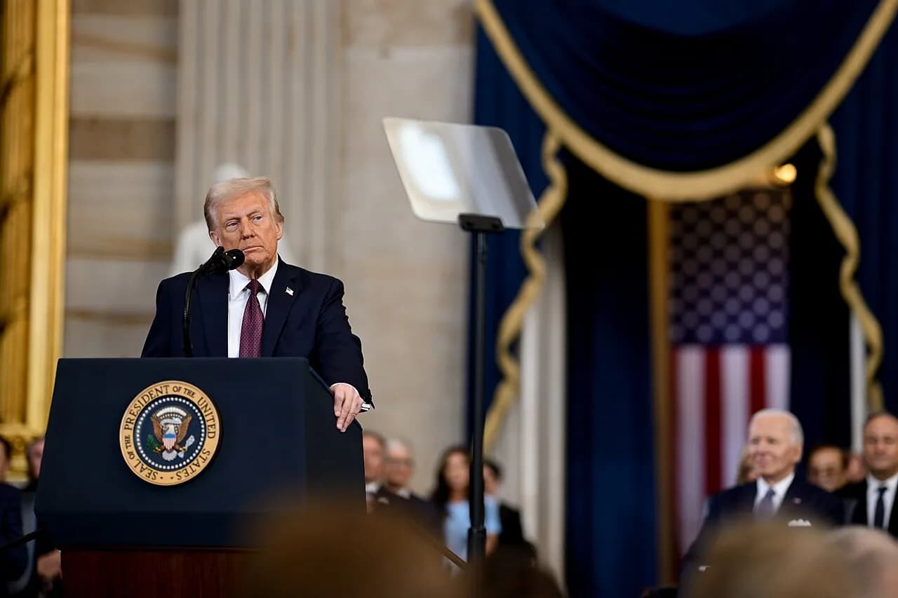 President Donald Trump speaks at a lectern during his 2025 inaugural address.
