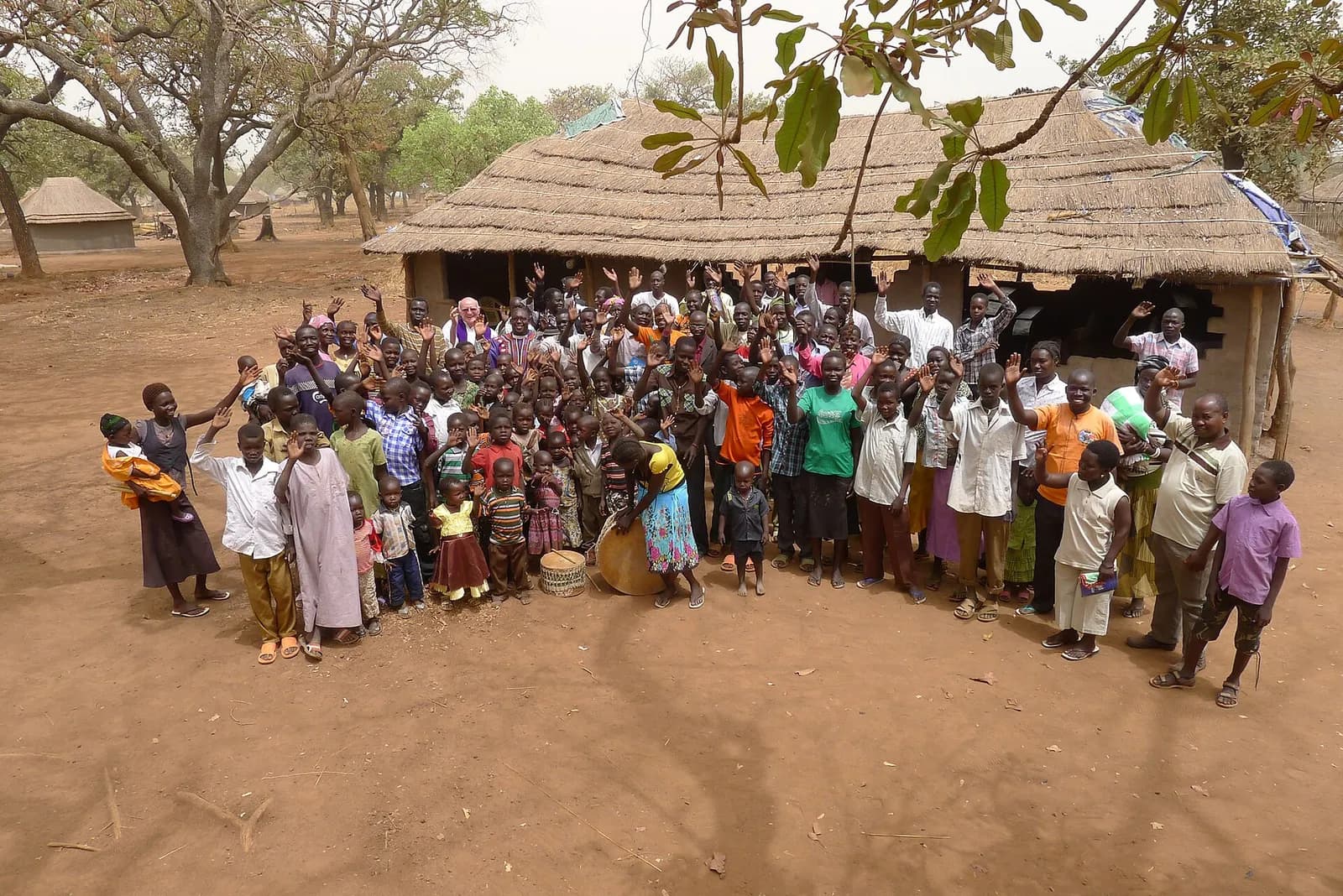 People gather outside the church of Wulu Catholic Mission in Lakes State, South Sudan.