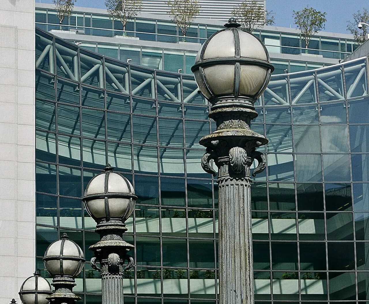 Street lamps in front of the glass facade of the SEC headquarters in Washington, D.C.