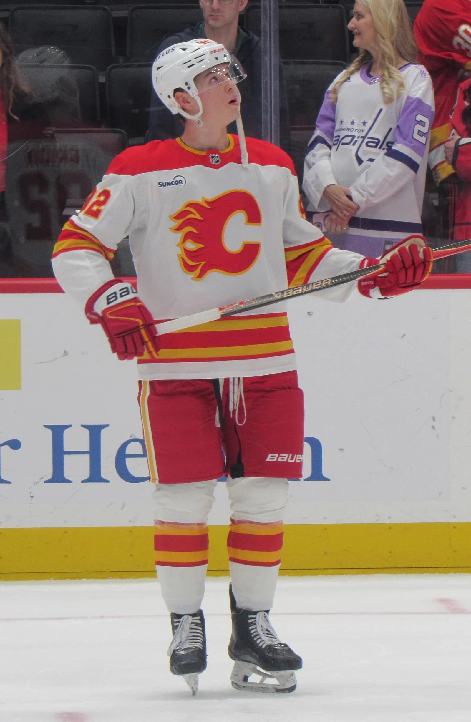 Calgary Flames forward Matvei Gridin stands on the ice during pregame warmups.