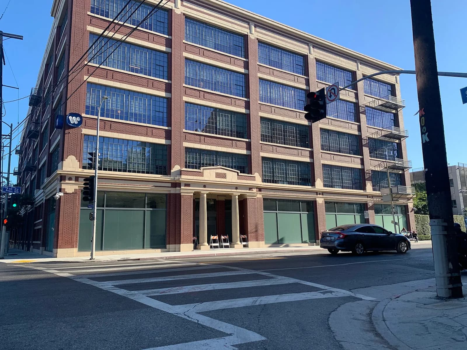 Exterior of a Warner Music Group building at the intersection of 7th Street and Santa Fe Avenue in Los Angeles.