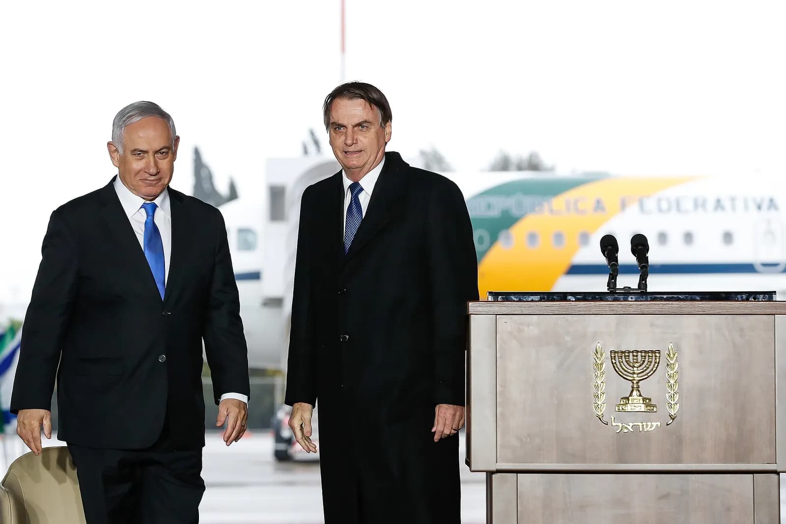 Benjamin Netanyahu and Jair Bolsonaro stand together during an official arrival ceremony in Tel Aviv.