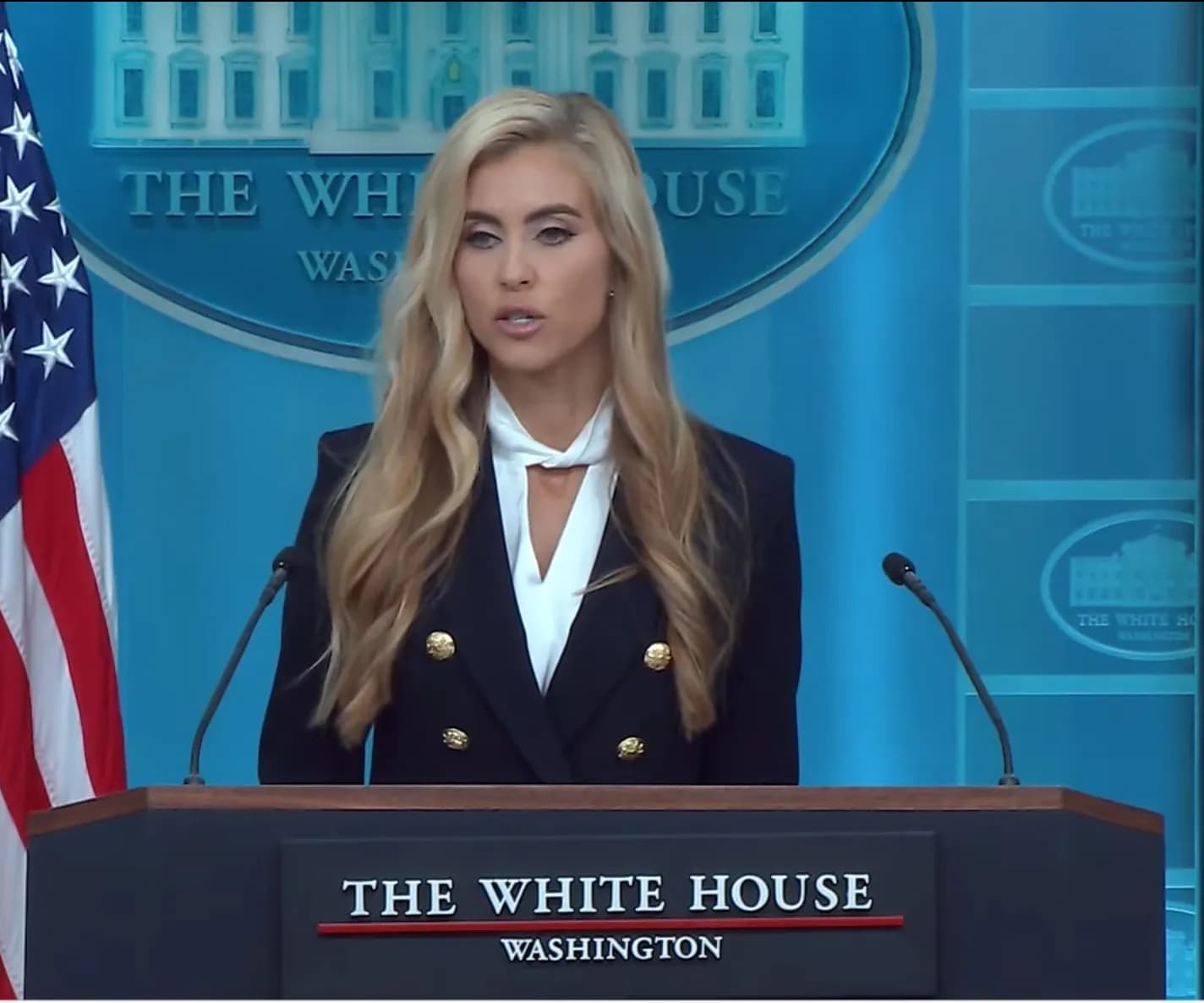 Katie Zacharia at the lectern during her first White House press briefing.
