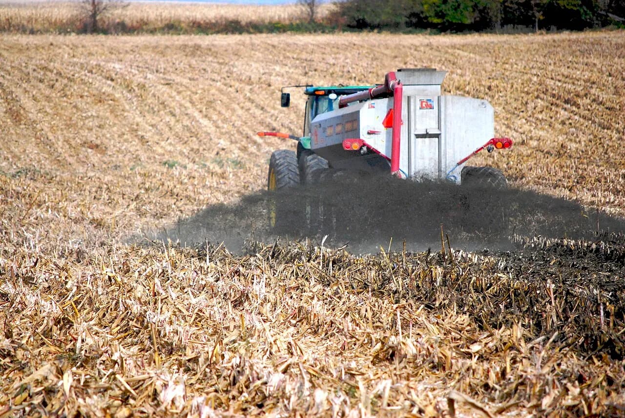 Liquid manure being spread across a harvested cornfield