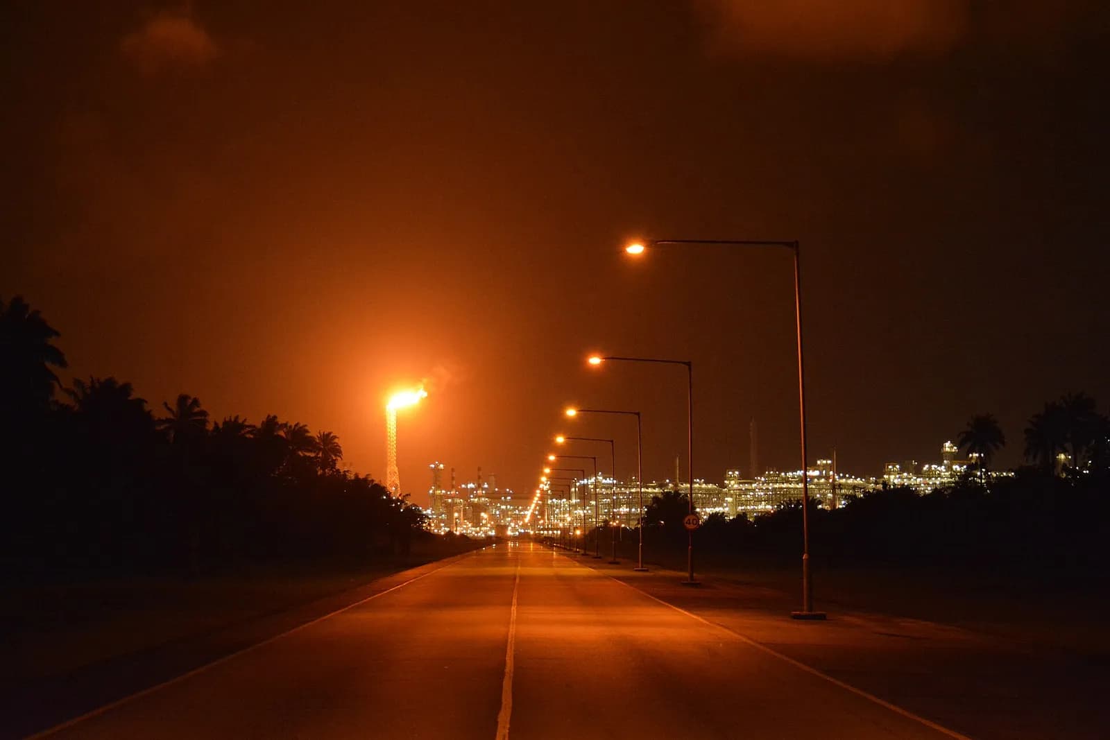 Nigeria LNG facility illuminated at night on Bonny Island, Nigeria.