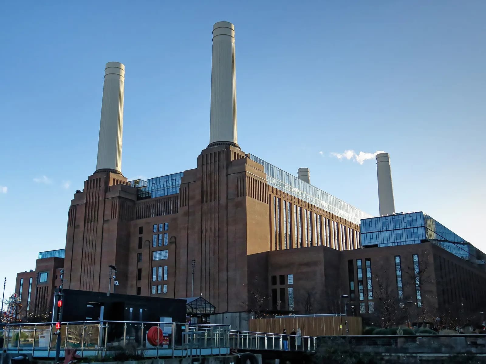 Battersea Power Station and its pier seen from the River Thames.