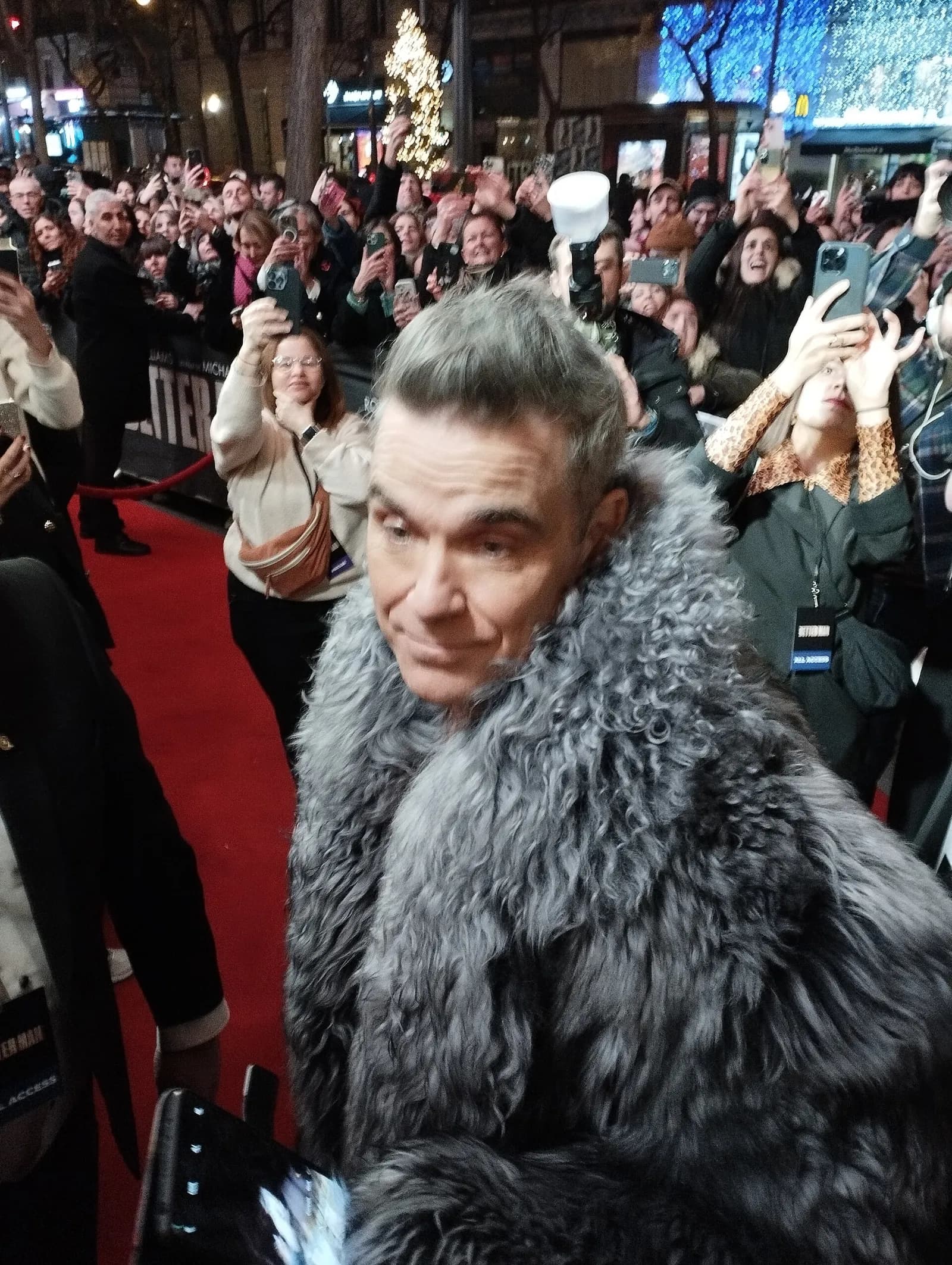 Robbie Williams arriving at a film premiere in Paris in December 2024