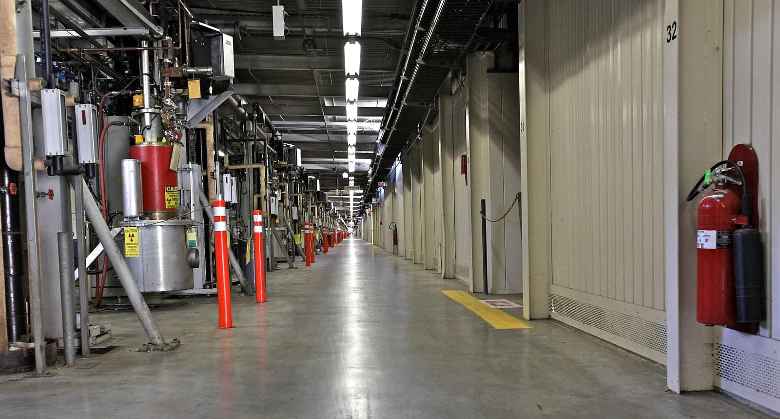 A row of klystron tubes along the SLAC linear accelerator, extending toward the horizon.