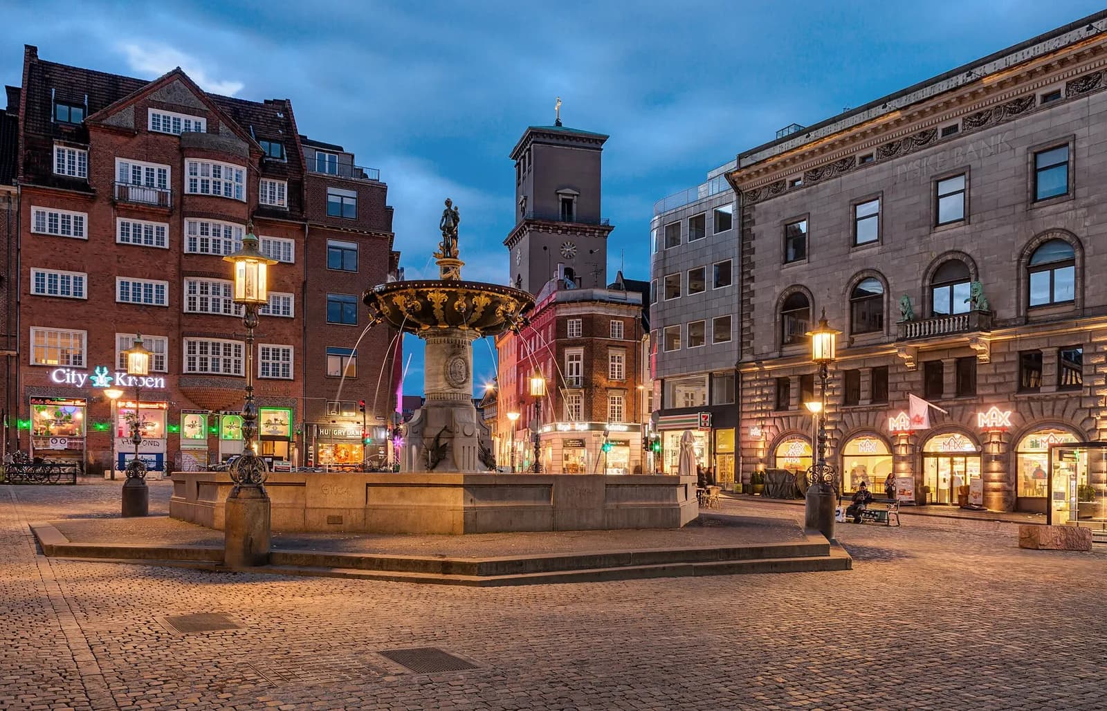 The Caritas Fountain at night in Copenhagen, Denmark.