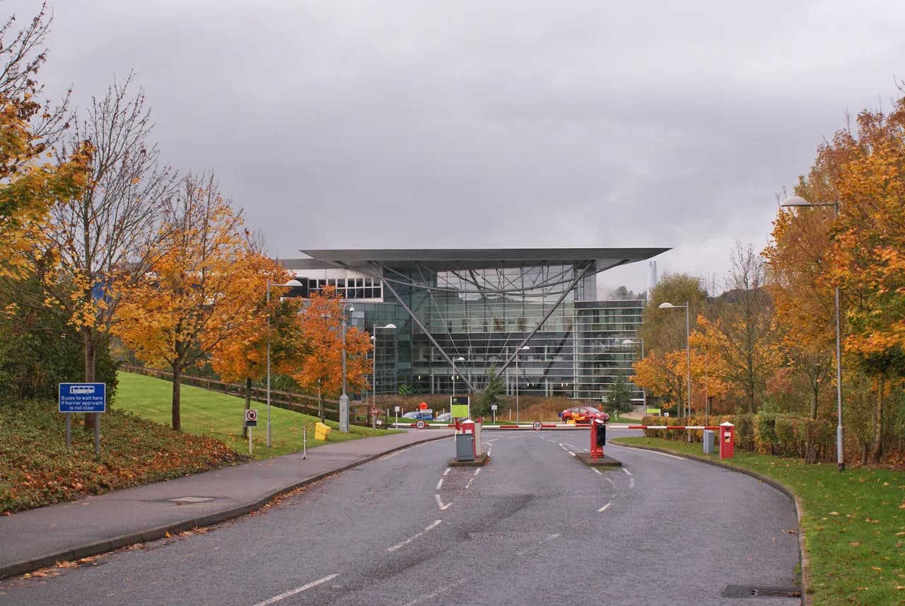 Entrance to the Met Office building in Exeter, with autumn foliage nearby.