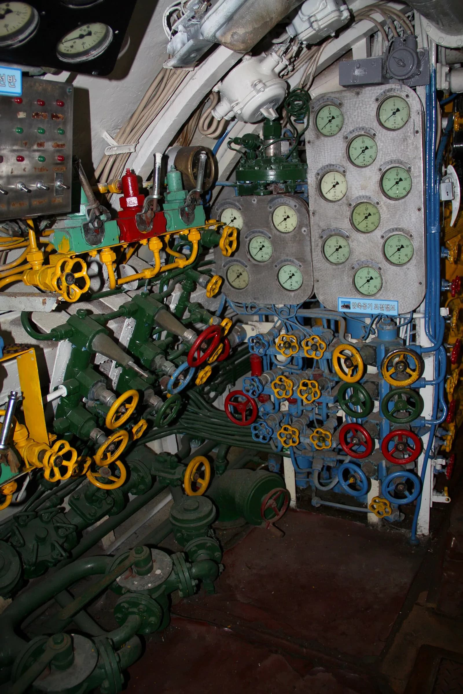 Interior control panel of a North Korean submarine, with gauges, pipes and valves.