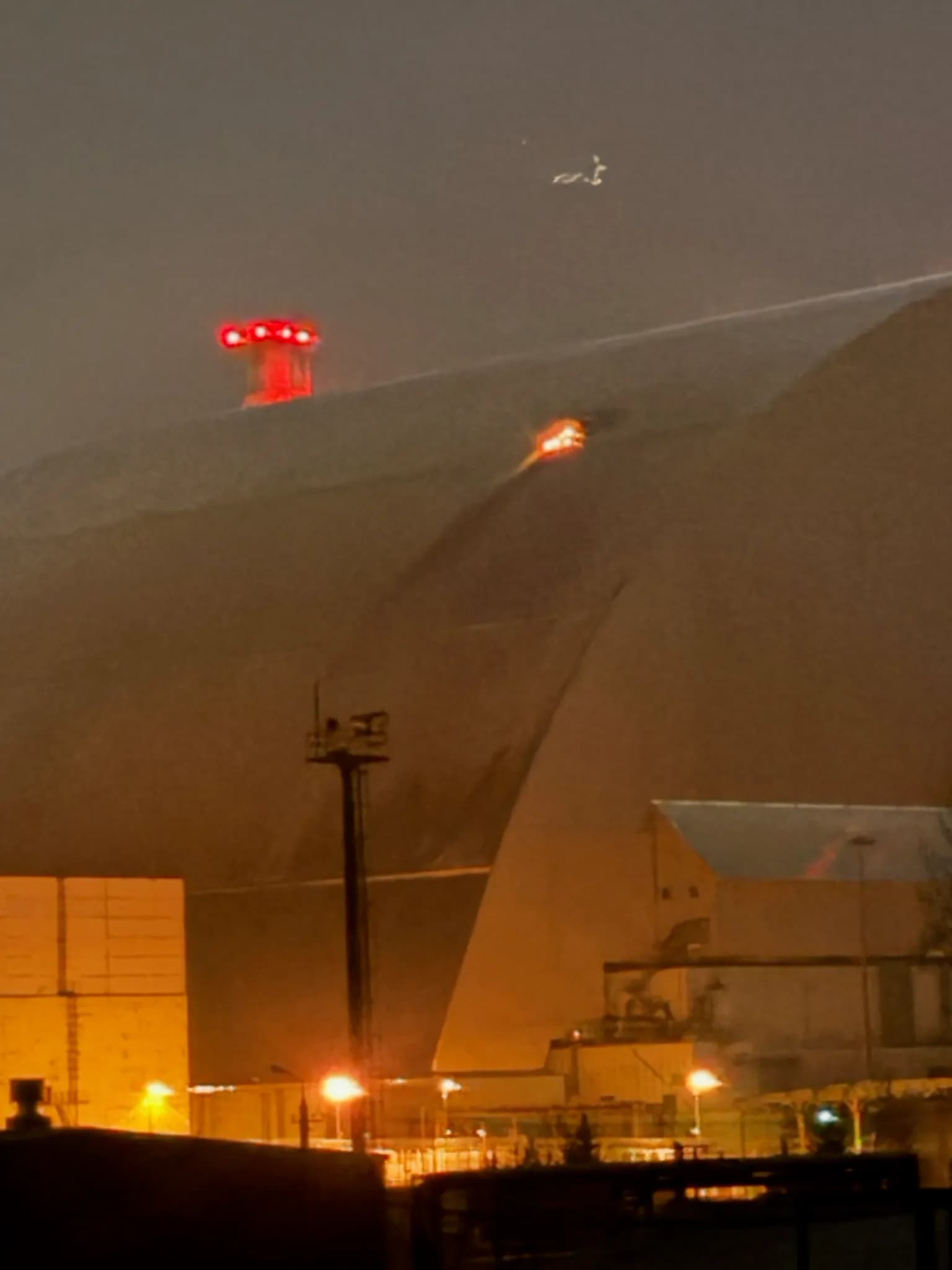 Fire and smoke at the New Safe Confinement over Reactor Four at the Chornobyl Nuclear Power Plant.