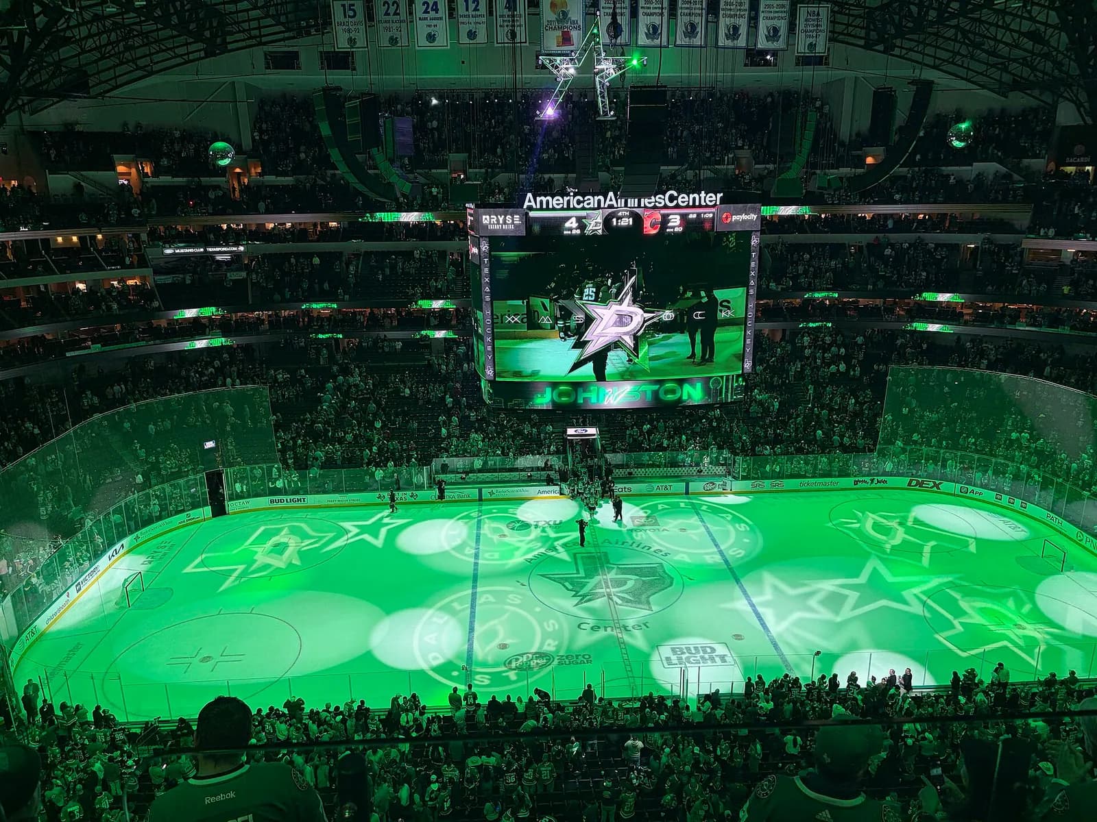 Interior of the American Airlines Center in Dallas, with the ice rink and seating visible after a Dallas Stars win.