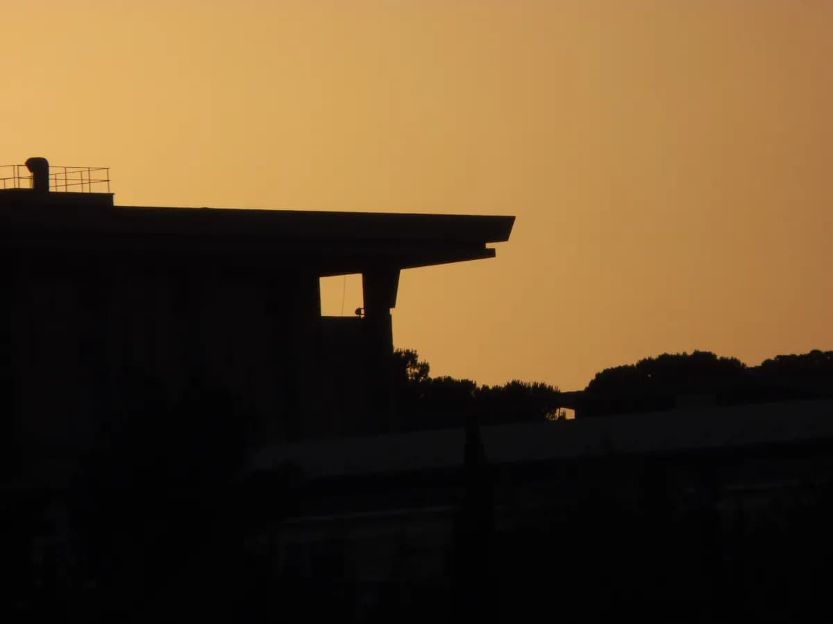 Silhouette of the Israeli Parliament building at dusk in Jerusalem.