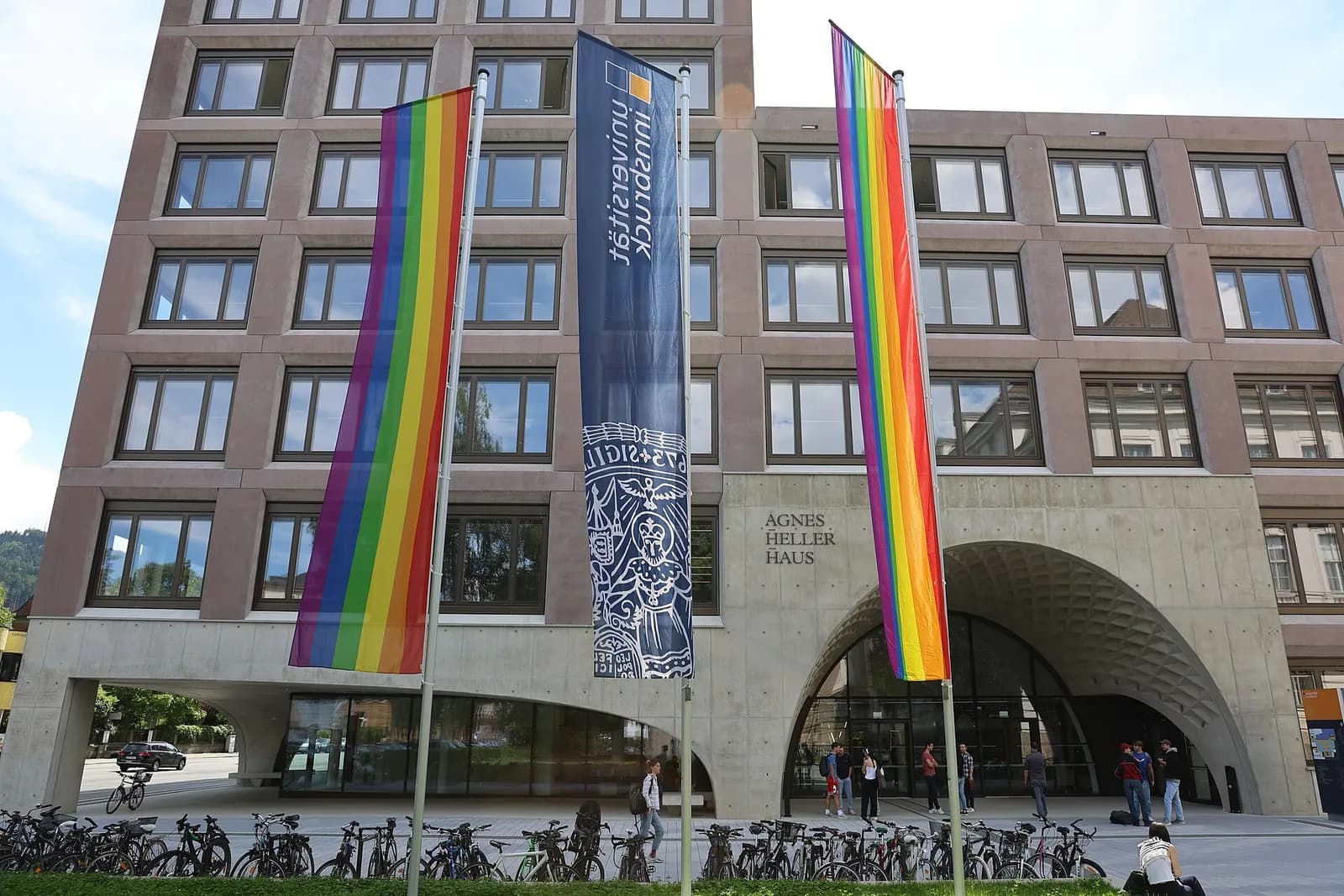 Rainbow flags outside the Ágnes-Heller Building at the University of Innsbruck.