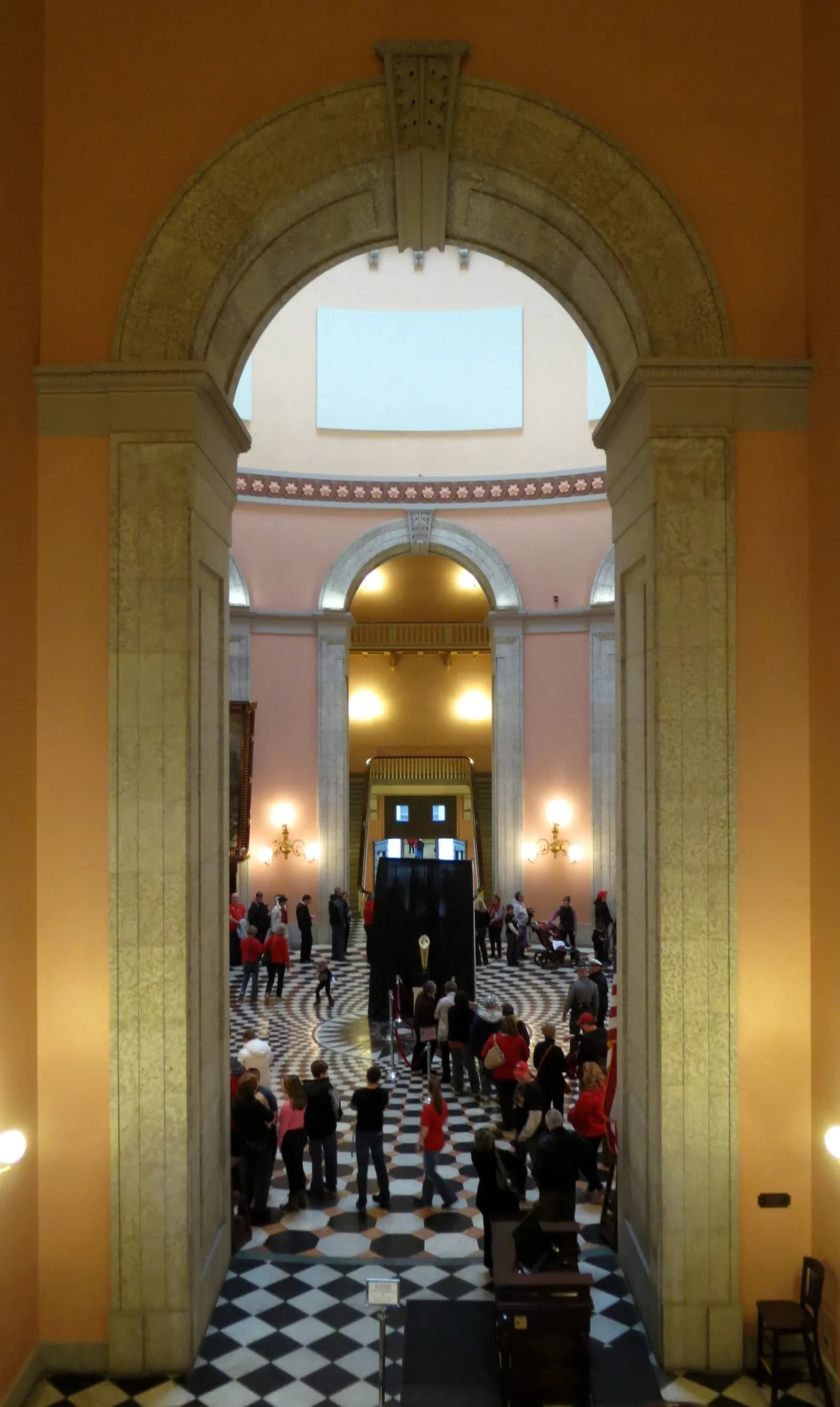 The College Football Playoff National Championship Trophy displayed in the Ohio Statehouse rotunda.