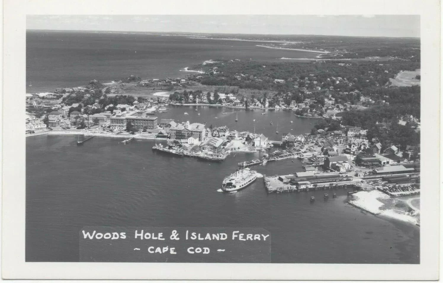 Aerial postcard view of Woods Hole Oceanographic Institution, the ferry landing and train station