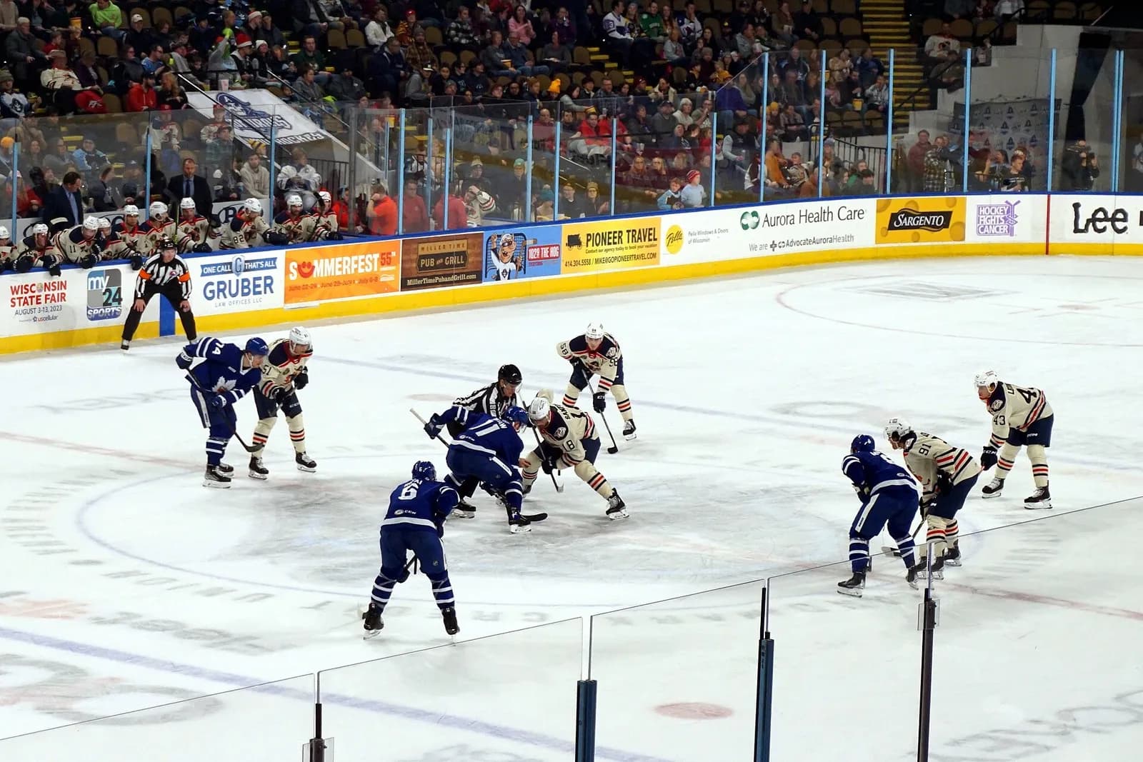 Toronto Marlies players line up for a face-off against the Milwaukee Admirals.