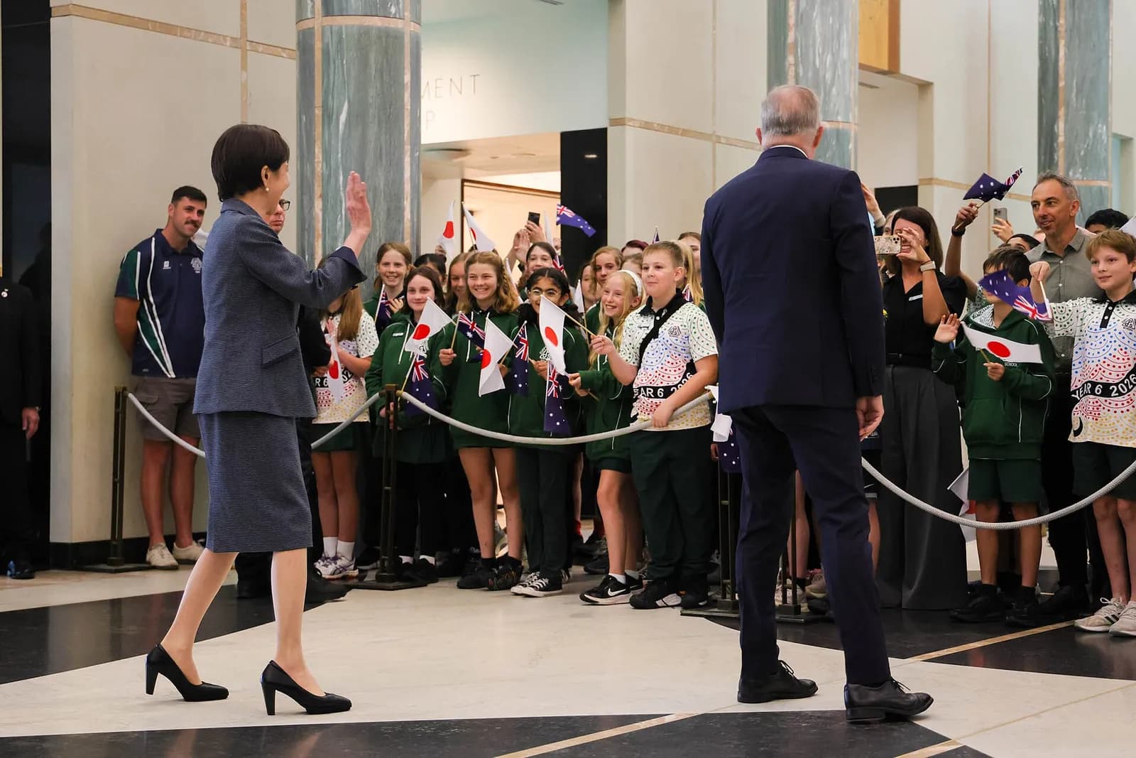 Sanae Takaichi meets children inside Parliament House in Canberra.
