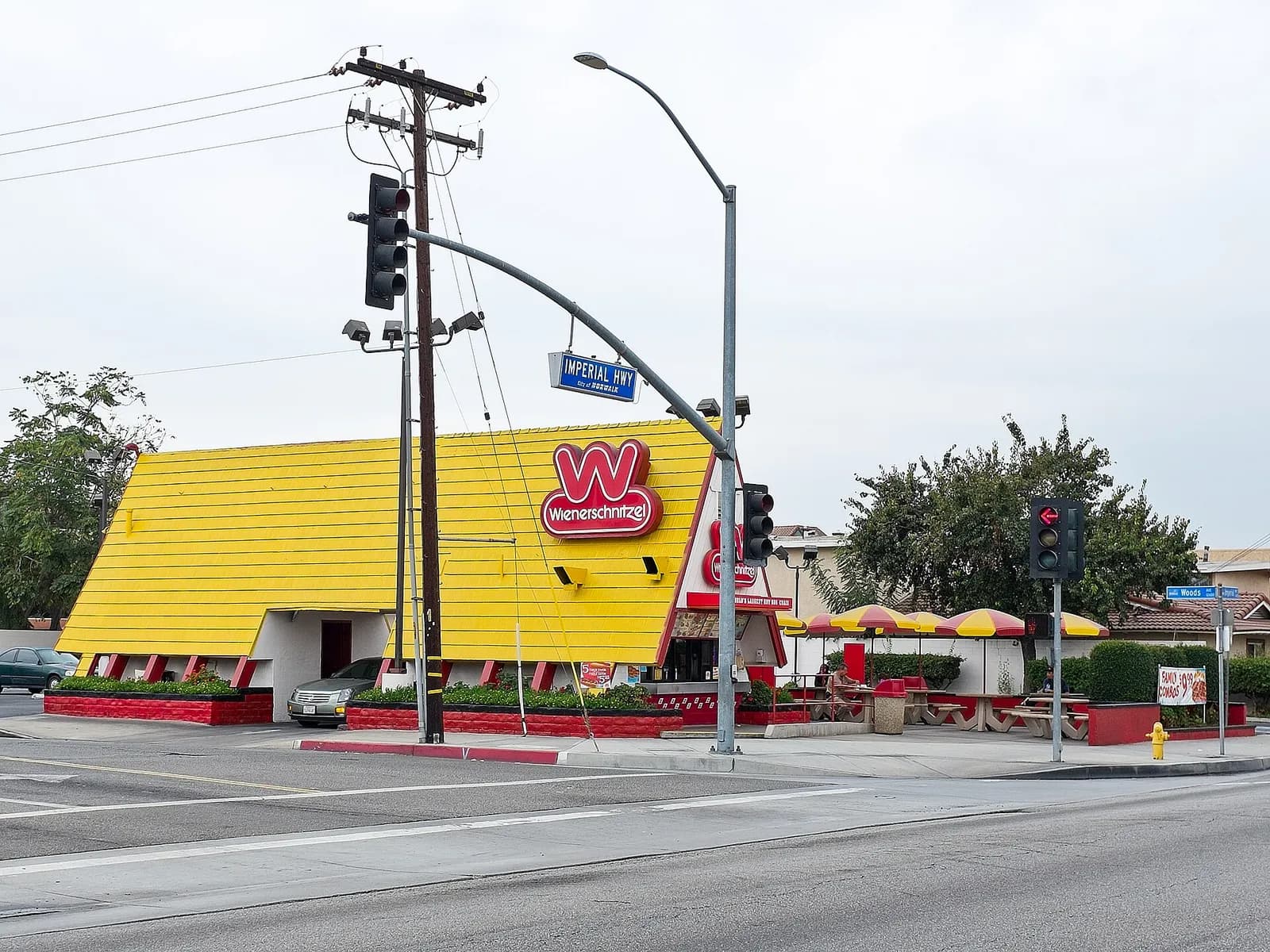 Exterior of a Wienerschnitzel hot dog restaurant at Imperial Highway and Woods Avenue in Norwalk, California.