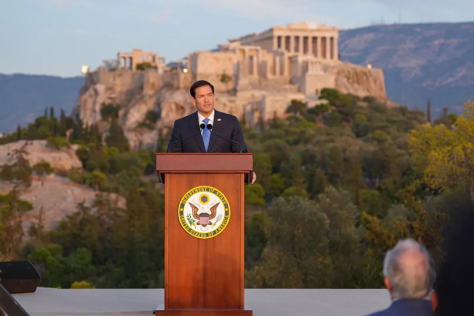 Marco Rubio speaks at the Acropolis in Athens, with the ancient site visible behind him.