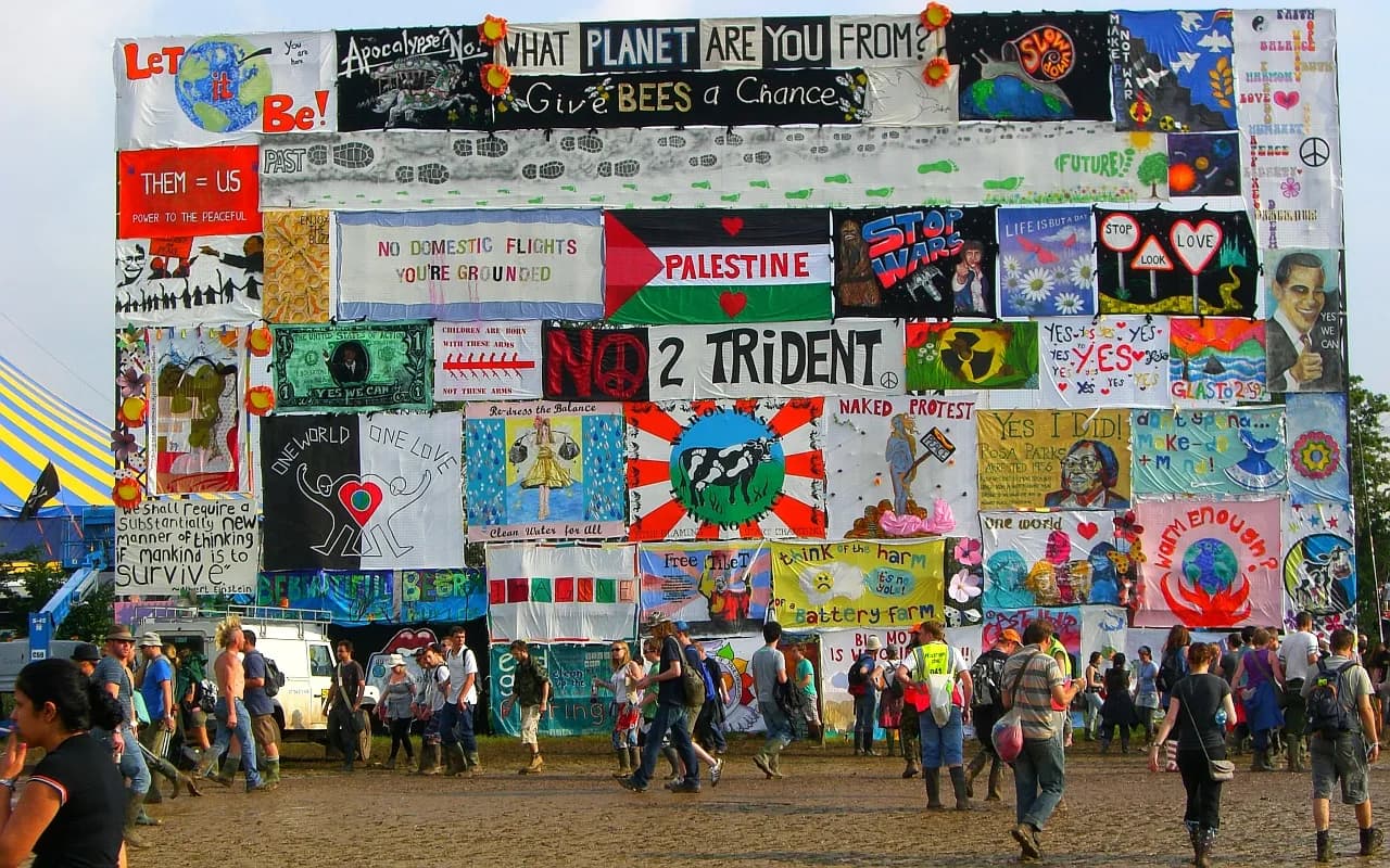 Festival signs and banners at Worthy Farm during Glastonbury Festival.