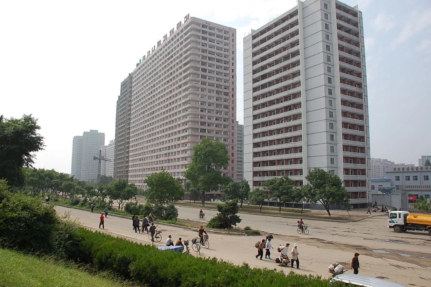 Buildings and passengers in Pyongyang, North Korea.