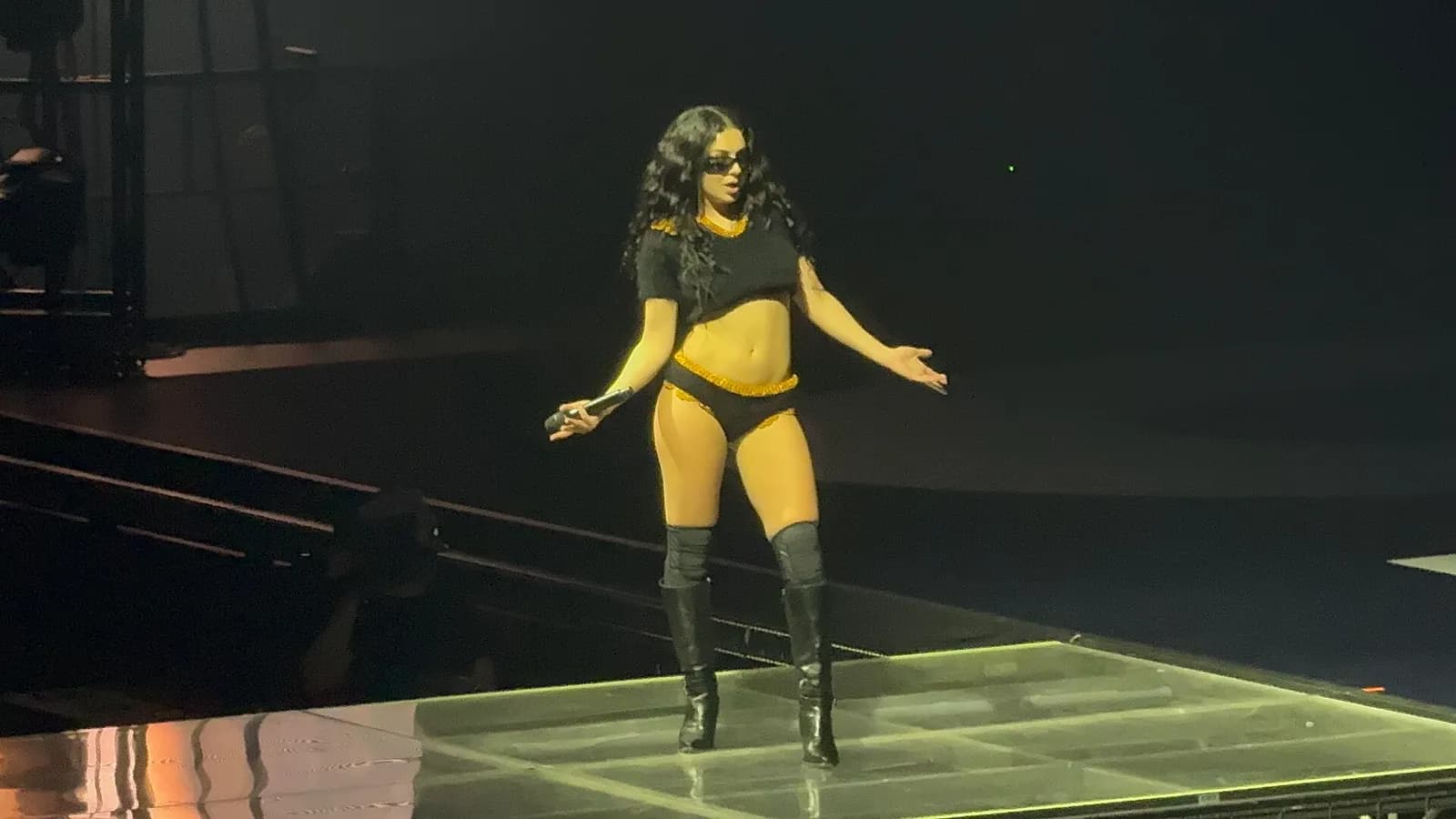 Charli XCX performing onstage during her Brat album tour.
