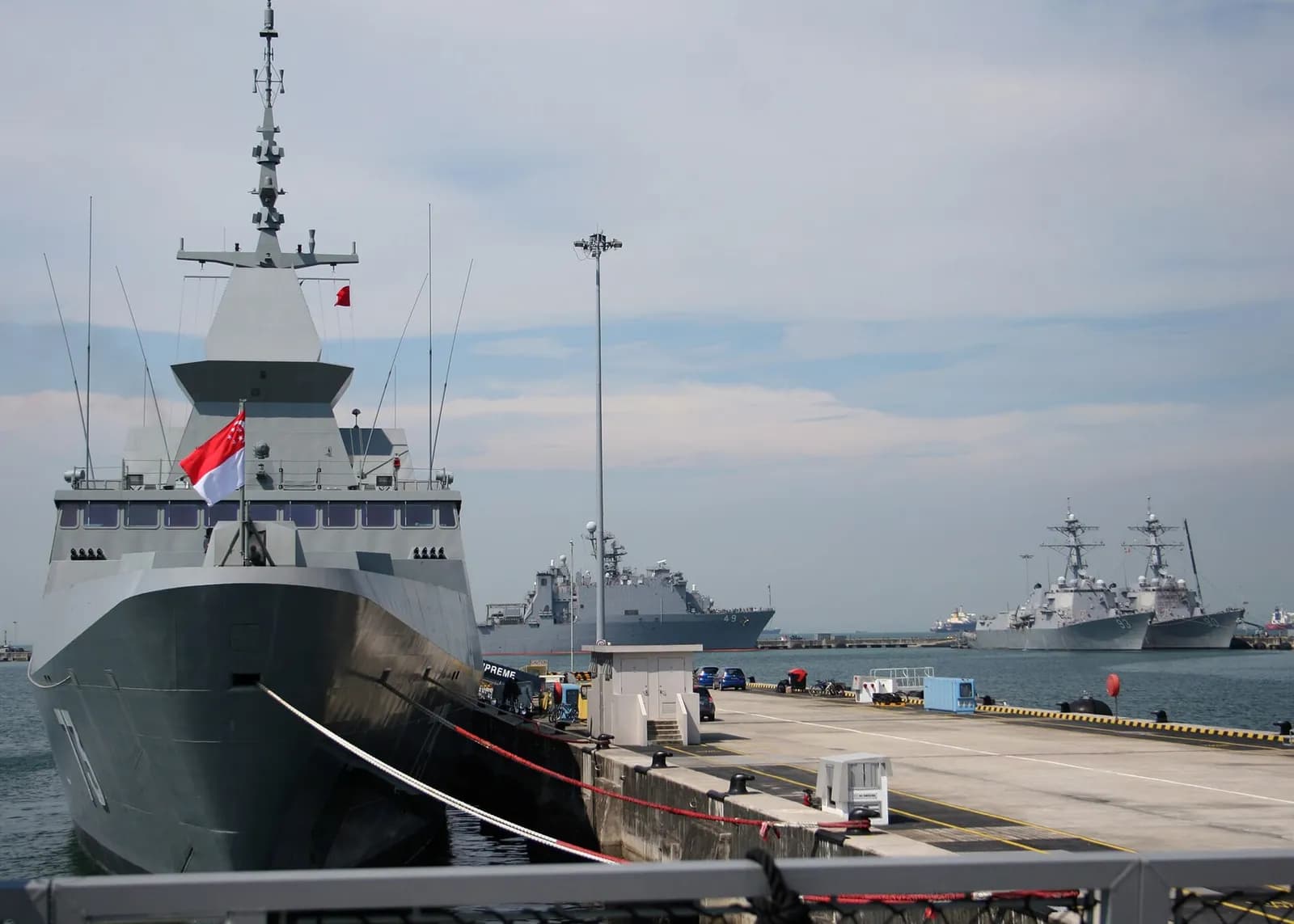 The Republic of Singapore Navy frigate RSS Supreme moored alongside U.S. Navy ships at Changi Naval Base.