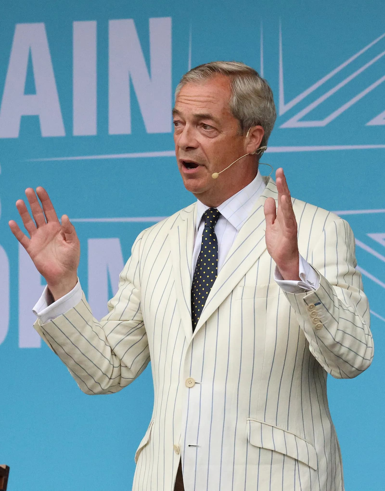 Nigel Farage addresses a Reform UK rally at Trago Mills in Devon in June 2024