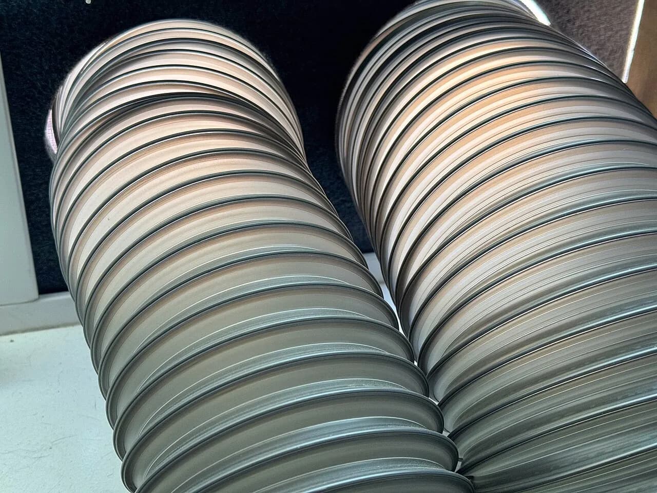 Air conditioner hoses fitted through a window