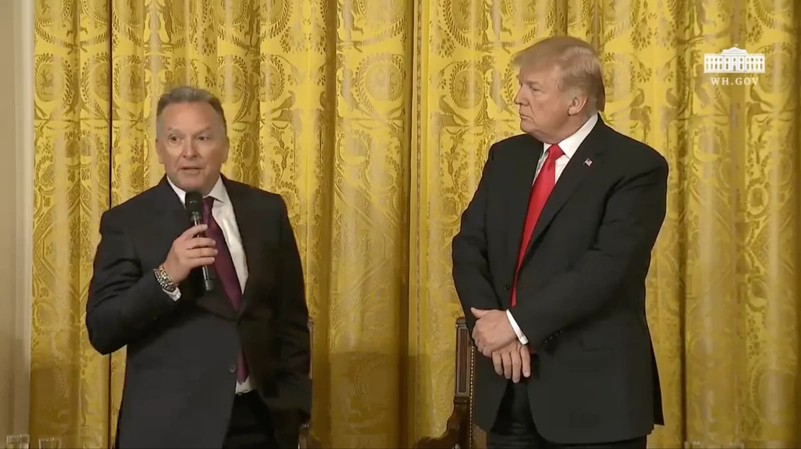 Steve Witkoff speaking on stage alongside Donald Trump at the White House Opioids Summit.
