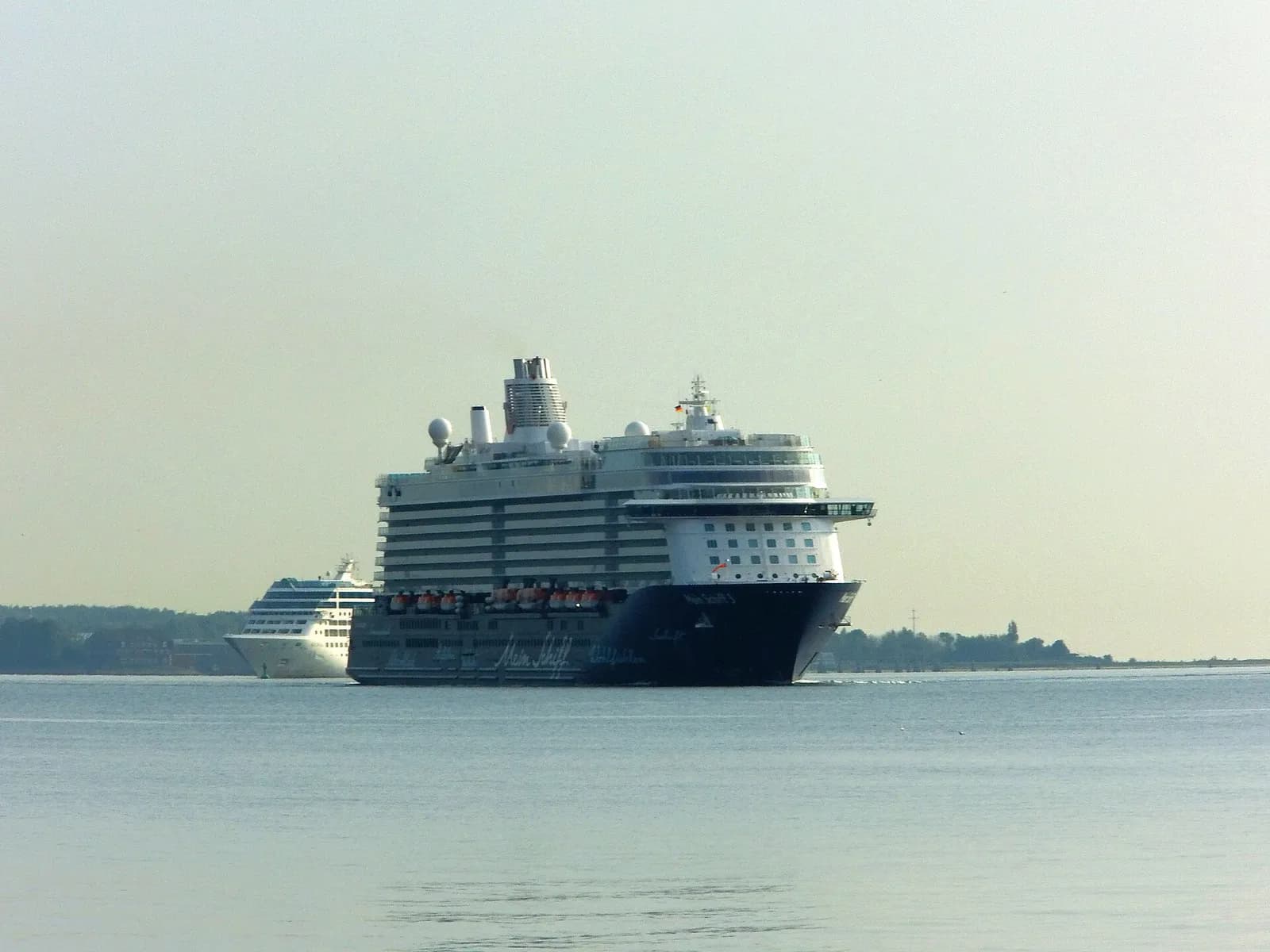 Mein Schiff 3 alongside another passenger ship in Kiel