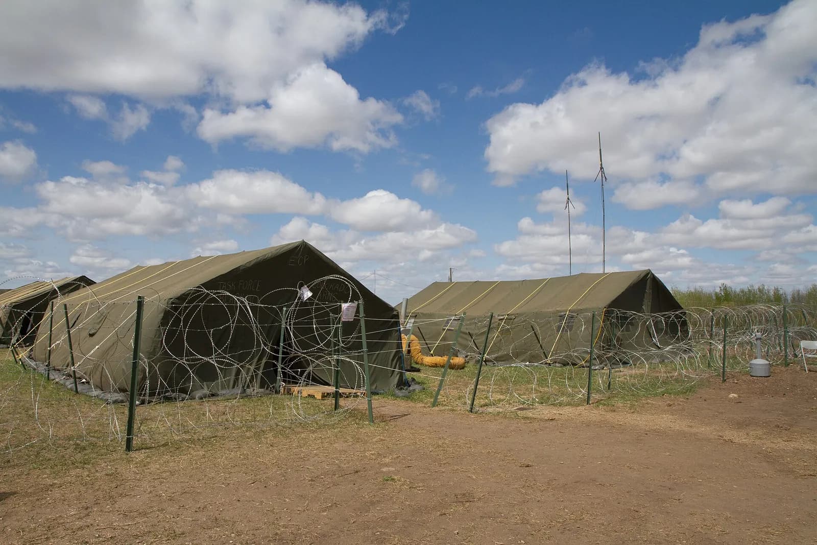Tents and fencing at a base camp during Exercise Maple Resolve at the Canadian Maneuver Training Center in Wainwright, Alberta.