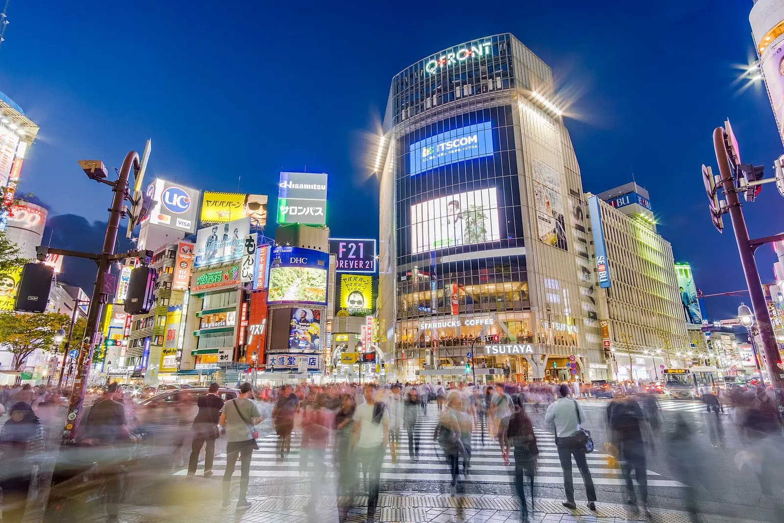 Pedestrians cross the Shibuya Scramble Crossing in Tokyo.