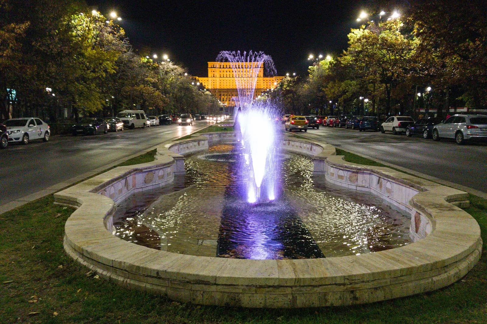 The Palace of Parliament in Bucharest seen behind fountains.