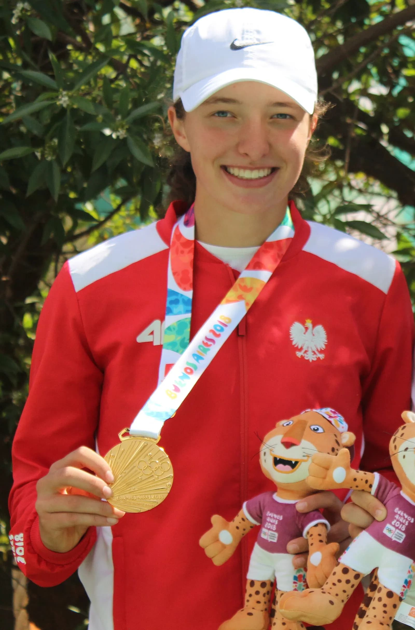 Iga Świątek at the 2018 Summer Youth Olympics girls’ doubles victory ceremony.