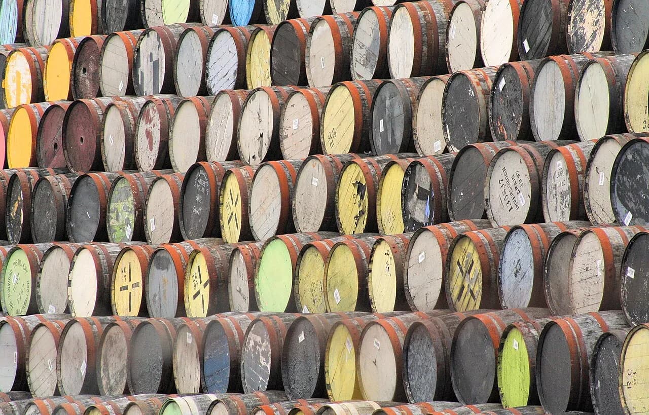 Empty oak whisky barrels at a distillery in Invergordon, Scotland