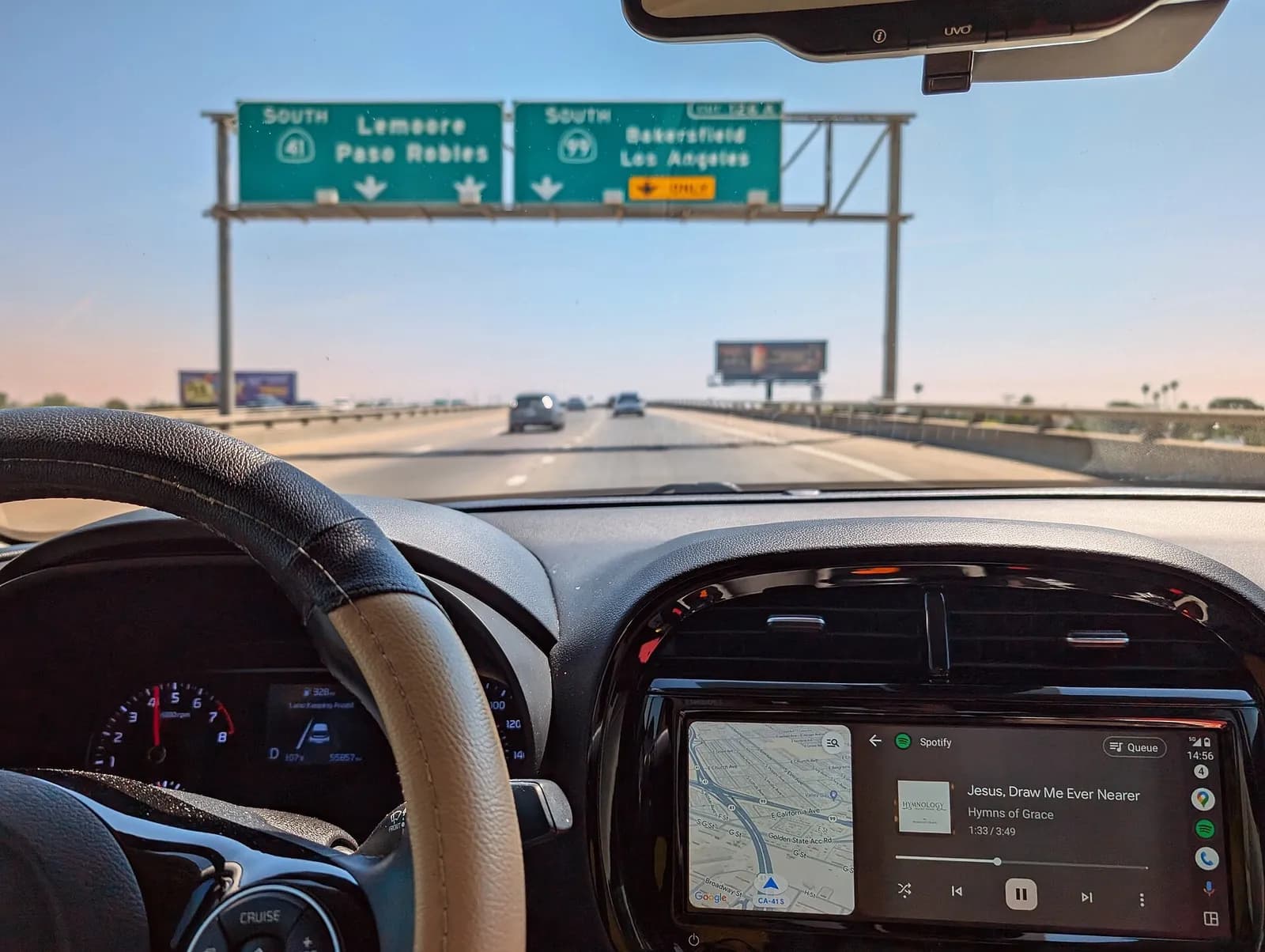 Android Auto displayed on a car dashboard during a road trip.