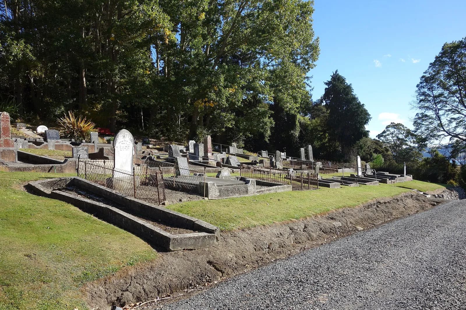 View across Waitati Cemetery toward its entrance.