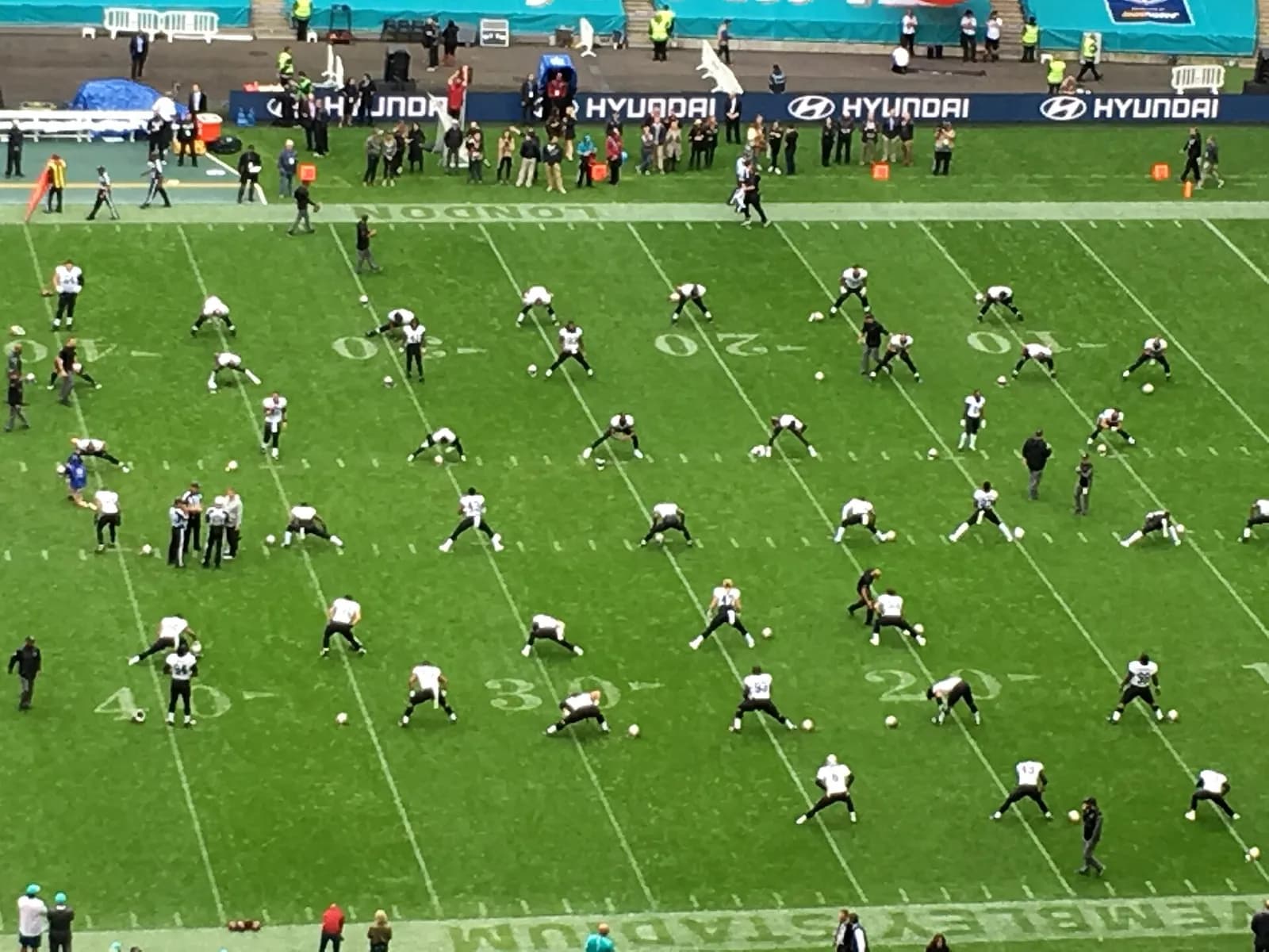 New Orleans Saints players warm up at Wembley Stadium in London.
