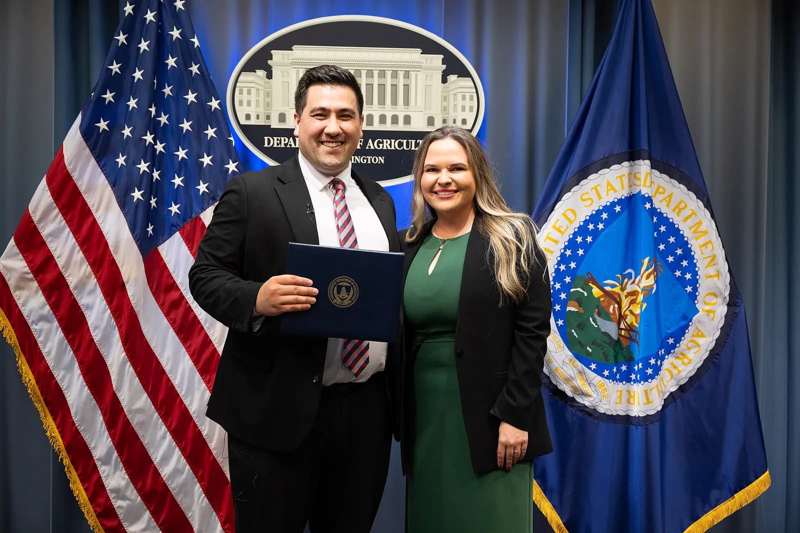 Dominic Restuccia swears in Mary Catherine Cromley at the U.S. Department of Agriculture.