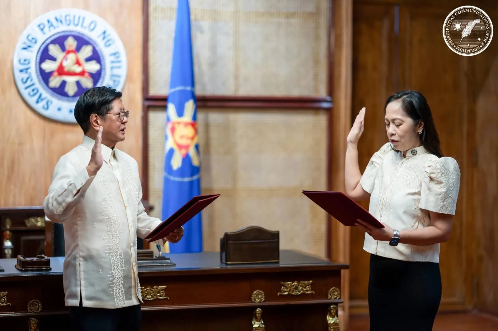 Sharon Garin takes an oath before President Bongbong Marcos.