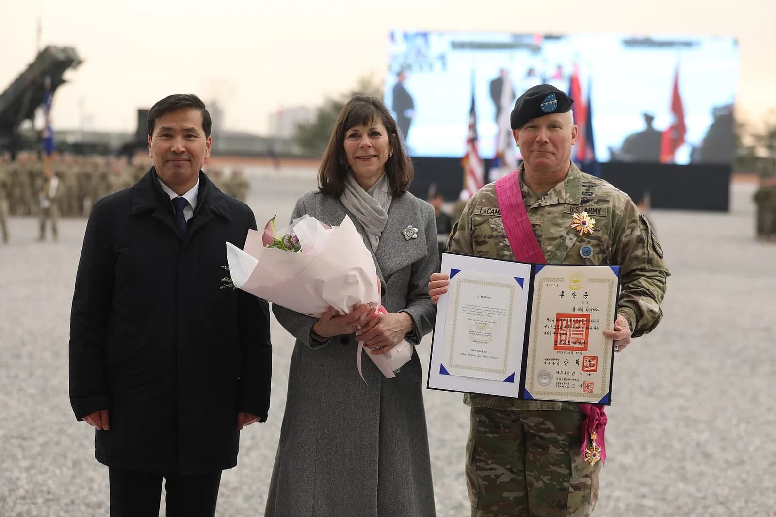 South Korean acting Defense Minister Seon-Ho Kim presents a medal to Gen. Paul J. LaCamera during a USFK, United Nations Command and Combined Forces Command change-of-command ceremony at Camp Humphreys.