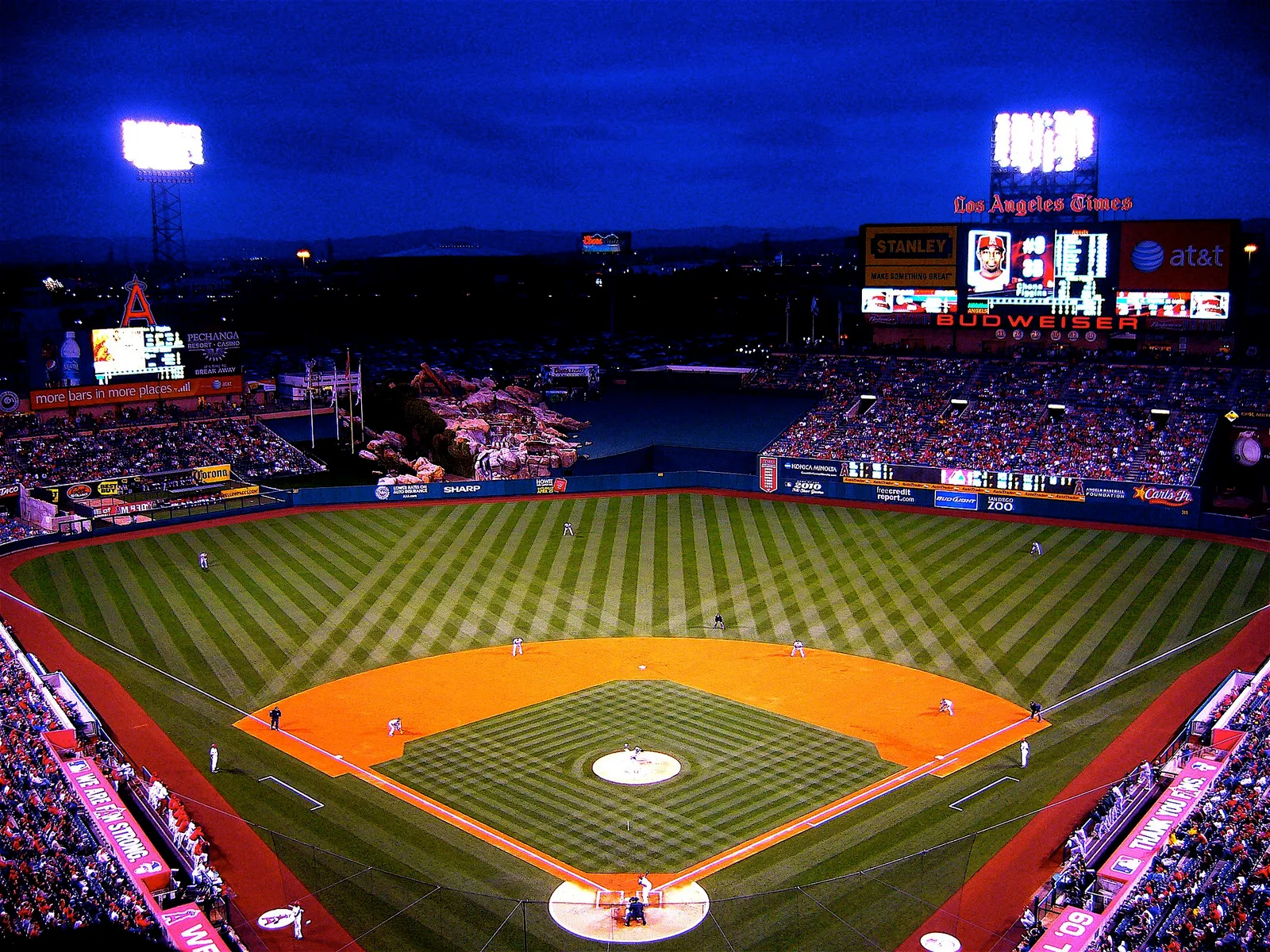 View of Angel Stadium of Anaheim from the seating area, with the baseball field and backstop visible.