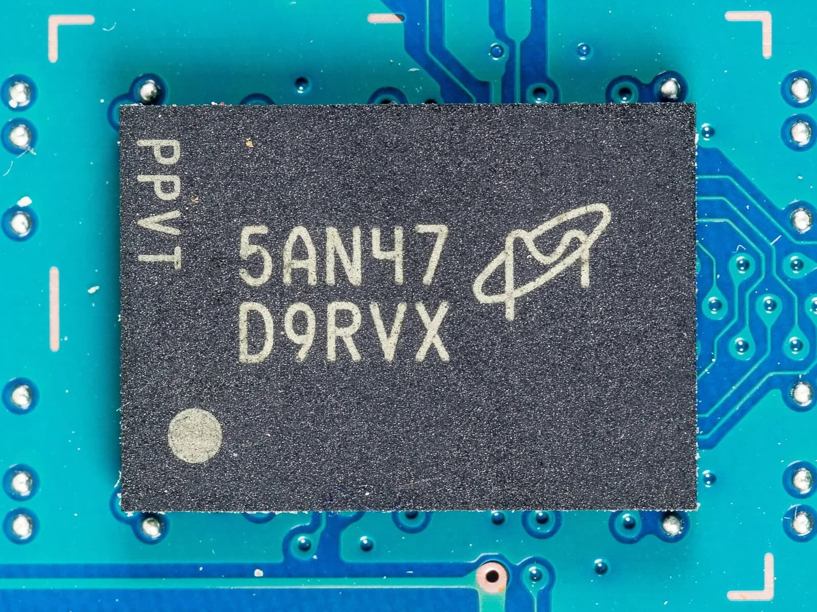 A close-up photograph of a Micron Technology memory chip marked 5AN47 D9RVX.