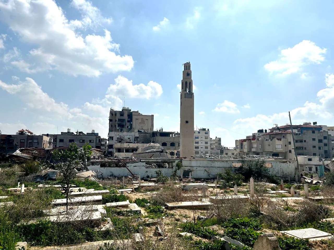 Sheikh Radwan Cemetery in Gaza City, with the ruins of an adjacent mosque.