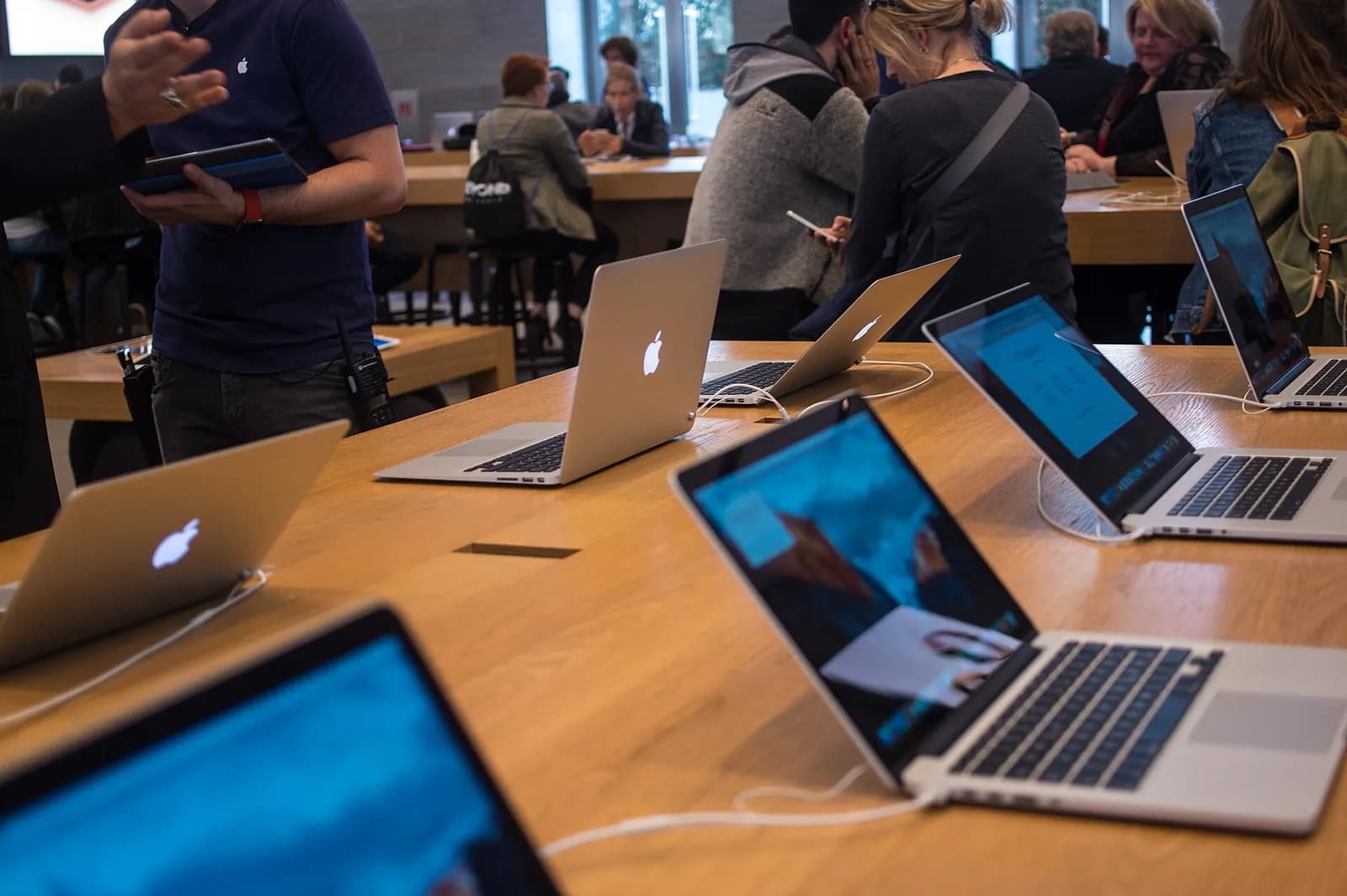 MacBook computers displayed in an Apple Store.