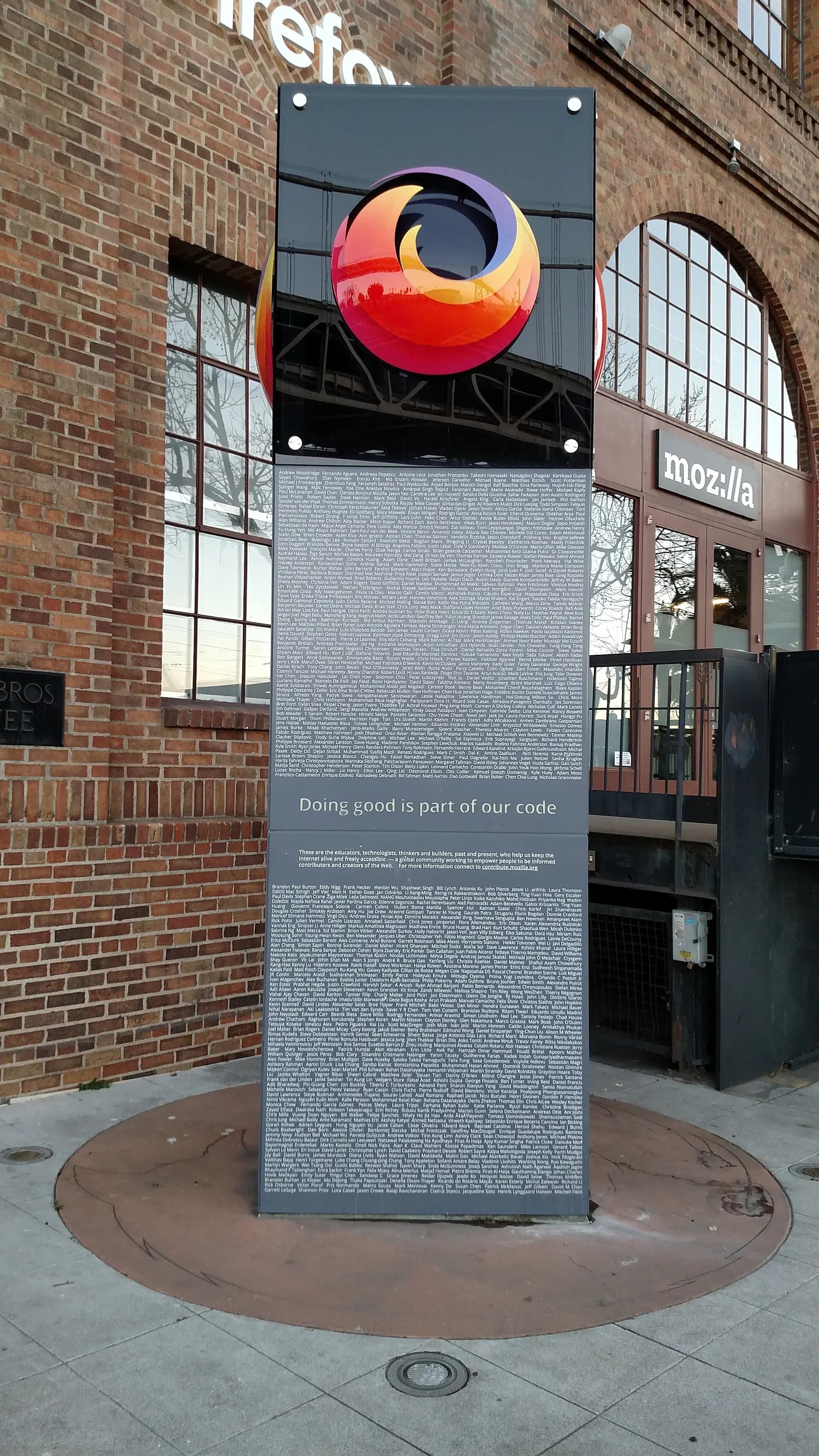 Monument in front of Mozilla’s San Francisco headquarters, with a Firefox logo and contributor names.