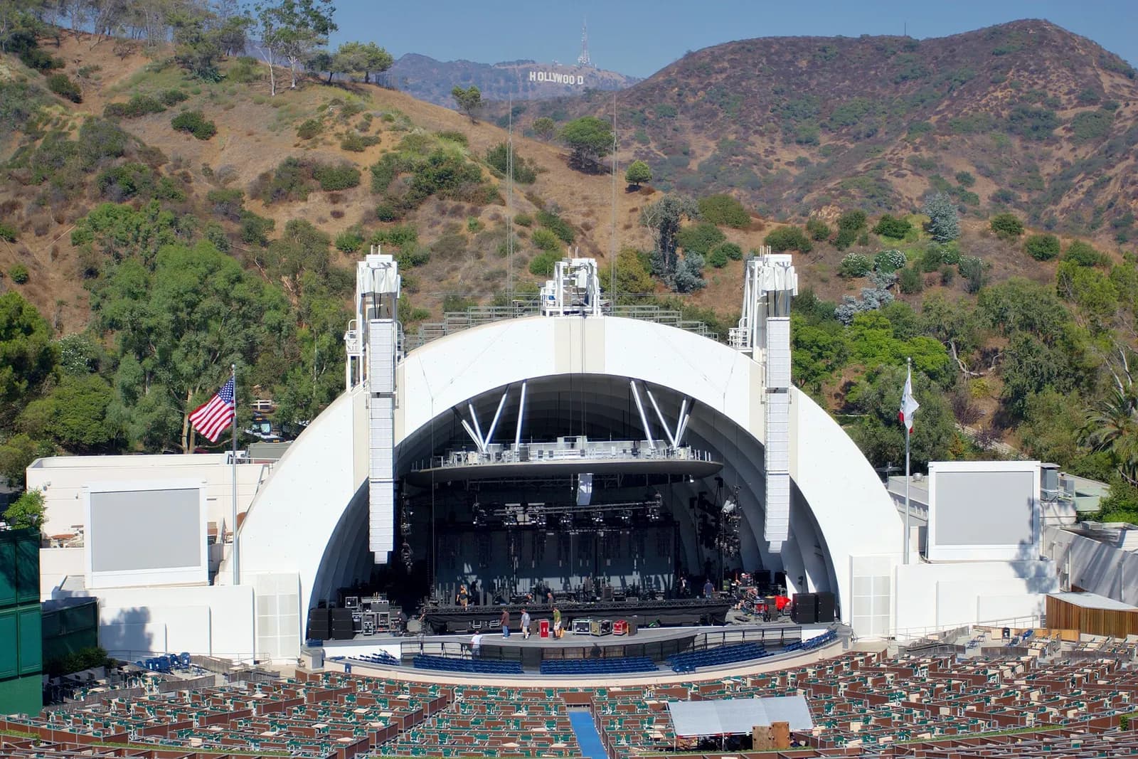 The Hollywood Bowl amphitheatre, with the Hollywood sign visible in the hills behind it.